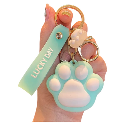 Paw Print Silicone Bag Charm Keychain – Cute Soft Touch Accessory with Lucky Day Tag