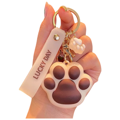 Paw Print Silicone Bag Charm Keychain – Cute Soft Touch Accessory with Lucky Day Tag